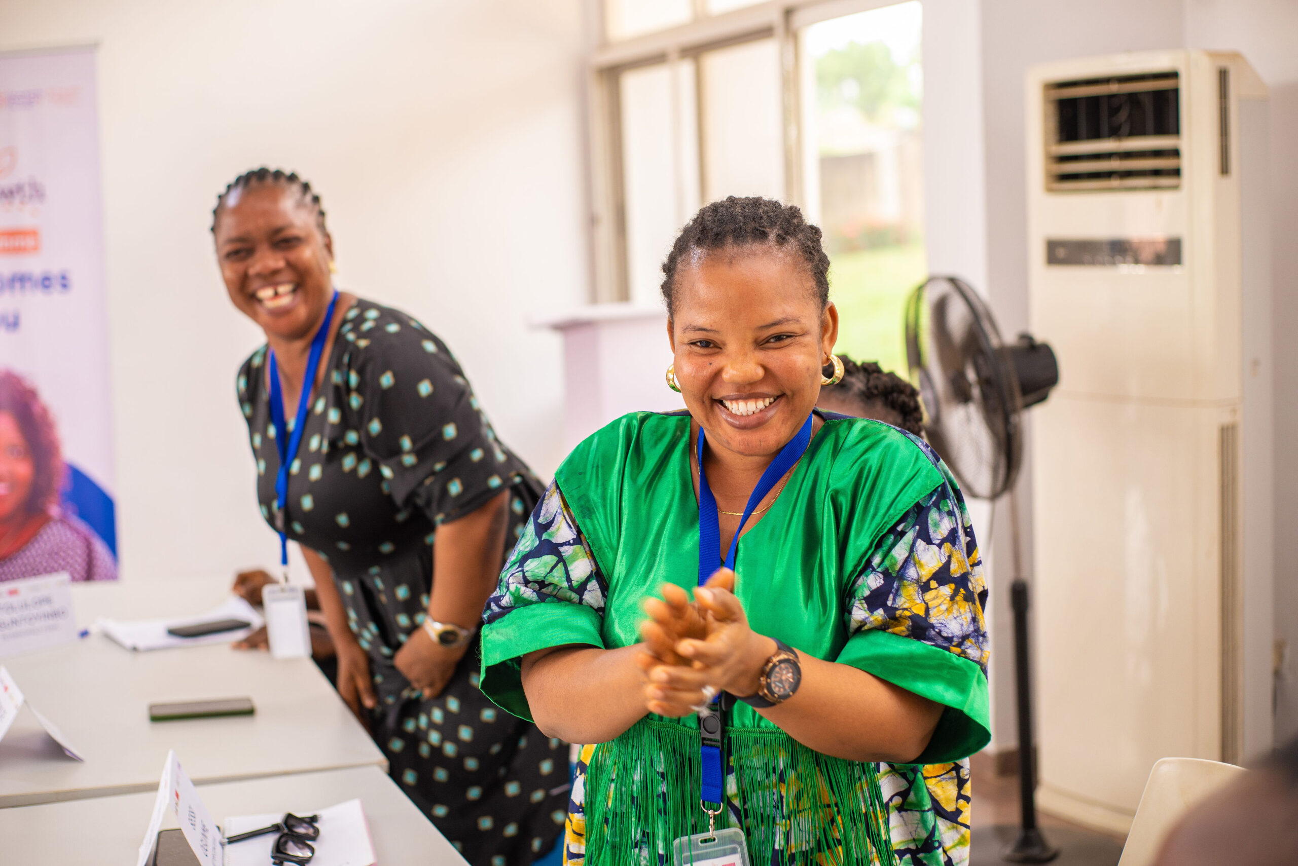 Smiling woman entrepreneur in a green suit